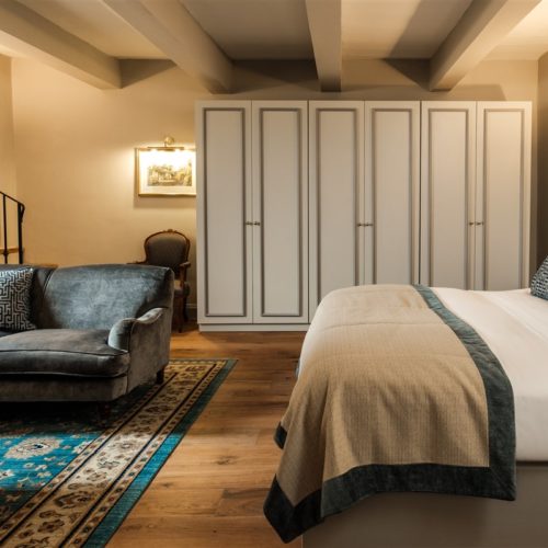 The bedroom of the Deluxe Suite with Terrace and Jacuzzi in the renovated 17th Century Palazzo that is The Xara Palace Relais & Chateaux located within the bastions of the Medieval City of Mdina Malta