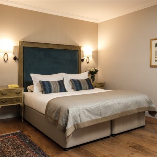 The bedroom of the Deluxe Suite with Terrace and Jacuzzi in the renovated 17th Century Palazzo that is The Xara Palace Relais and Chateaux 5 Star Hotel located within the bastions of the Medieval City of Mdina Malta